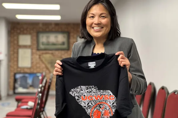 U.S. Secretary of Labor Julie Su with United Campus Workers South Carolina union t-shirt
